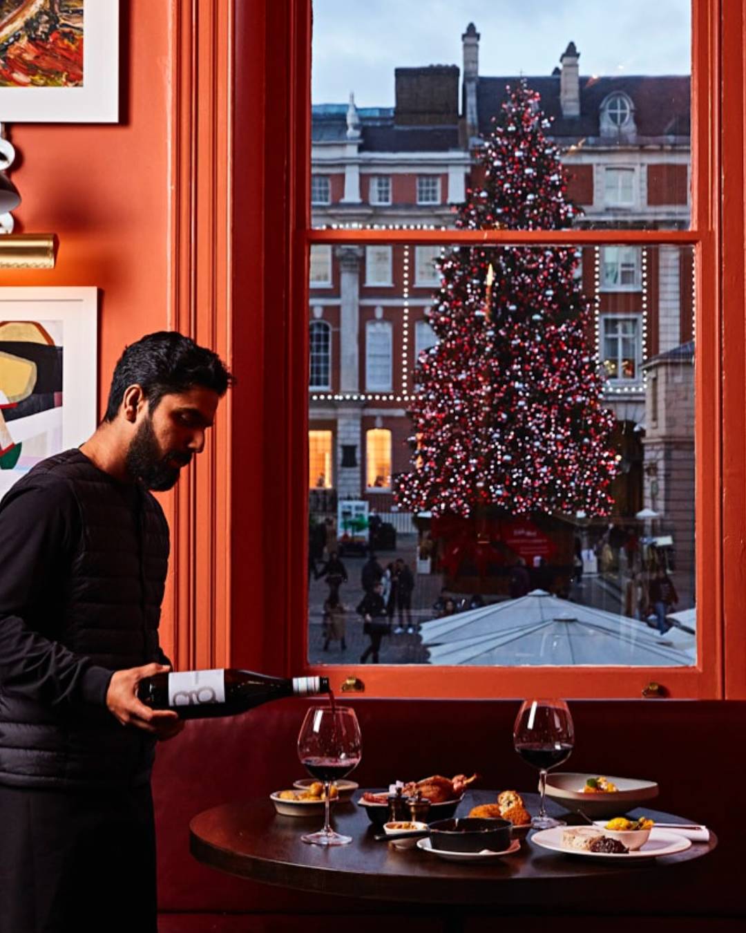 man pouring wine at pivot
