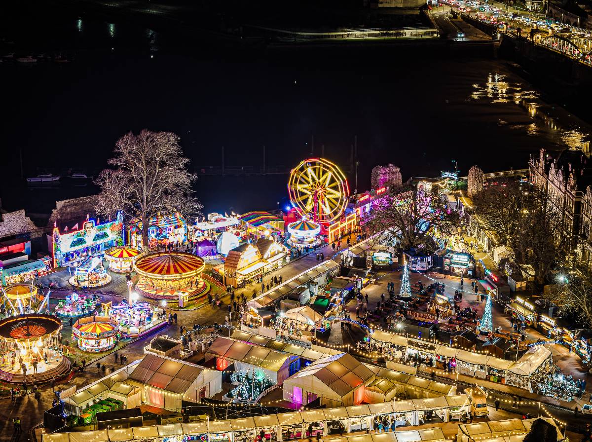 Rochester Christmas Market featuring funfair raides, stalls and Christmas lights