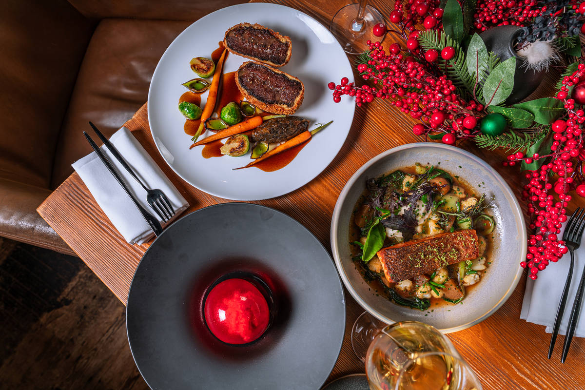 a festive display of dishes, from roasted salmon to a christmas bauble shaped dessert