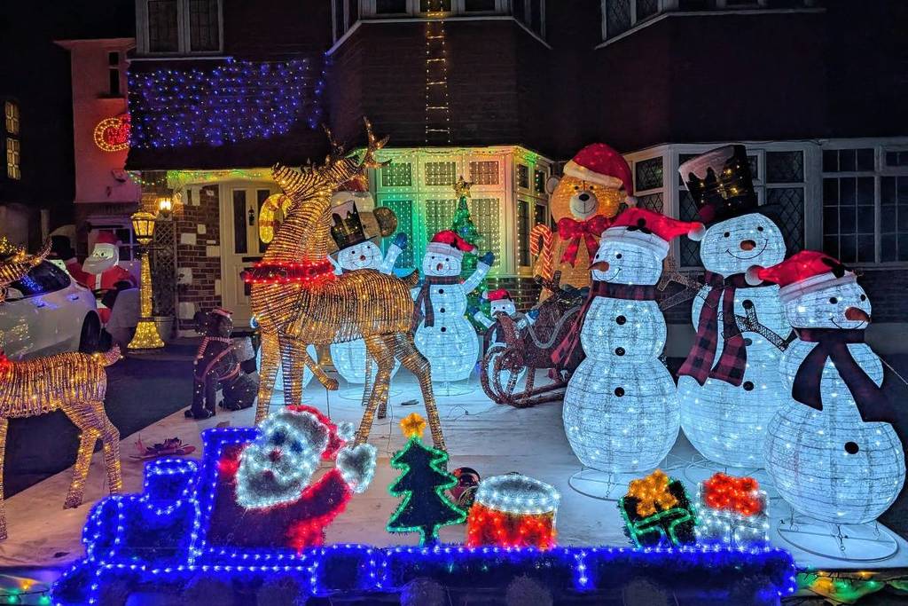 A house on Lower Morden Lane decorated in Christmas lights including snowmen, reindeer and a teddy bear