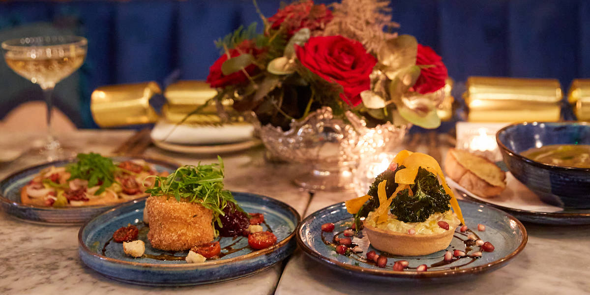 an array of italian starters at a festively decorated table