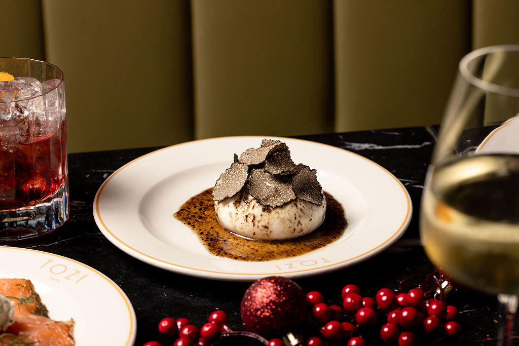 a burrata drizzled with black truffle honey