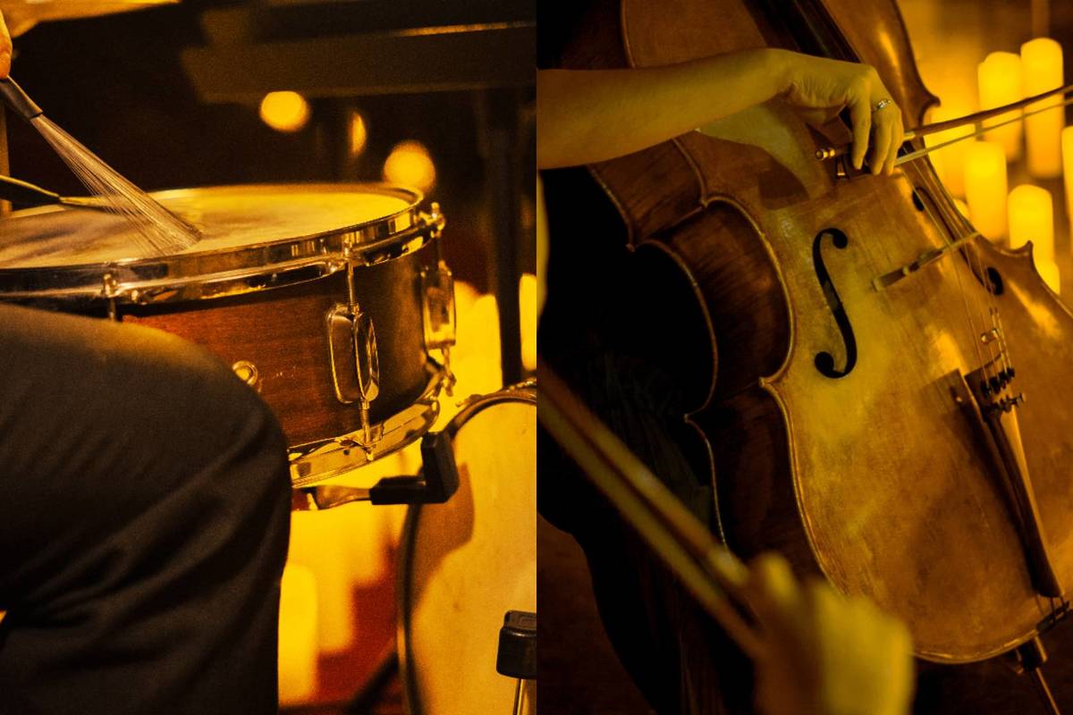 A drum set and a cello player performing by candlelight