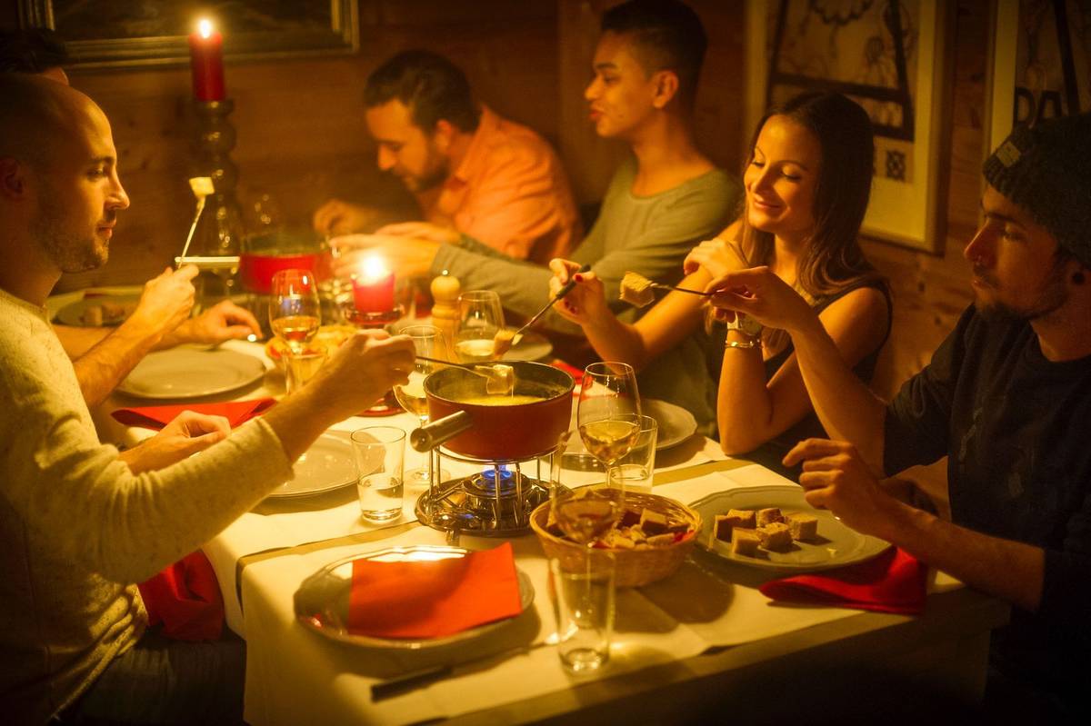 a group of people enjoying fondue