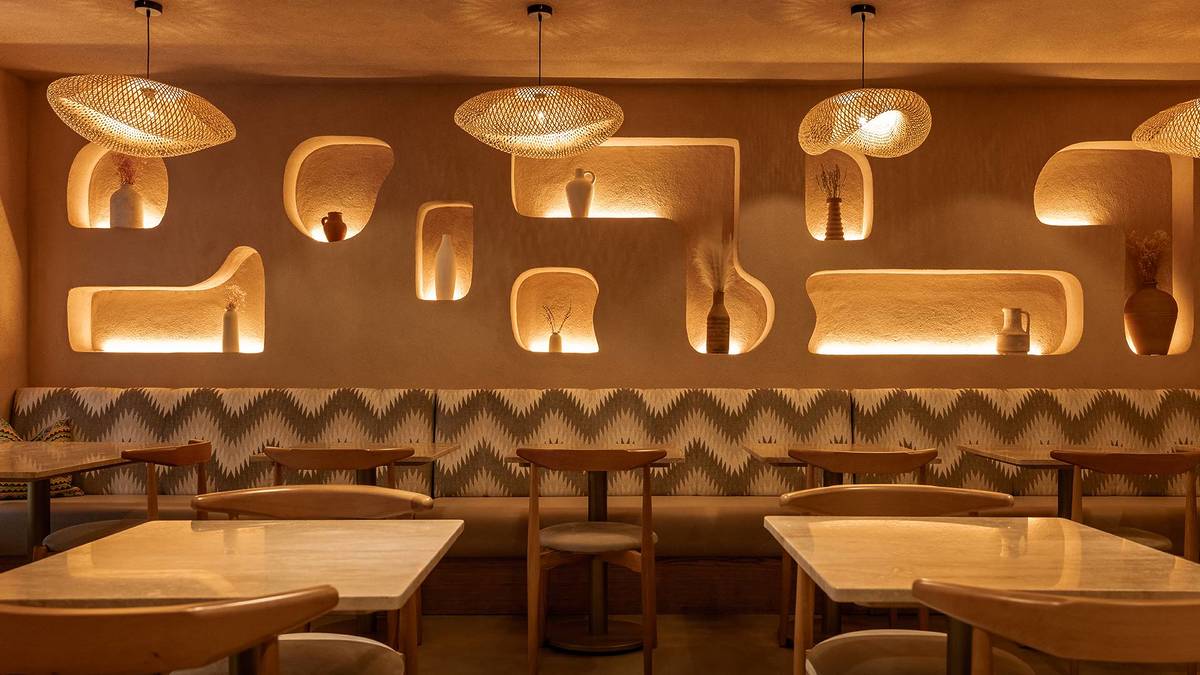 Interiors with dining area at Qima Cafe in Covent Garden, London