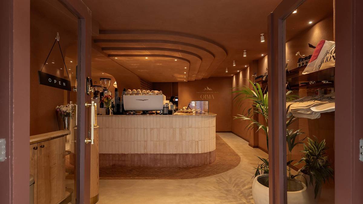 Inside Qima Café with coffee bar.