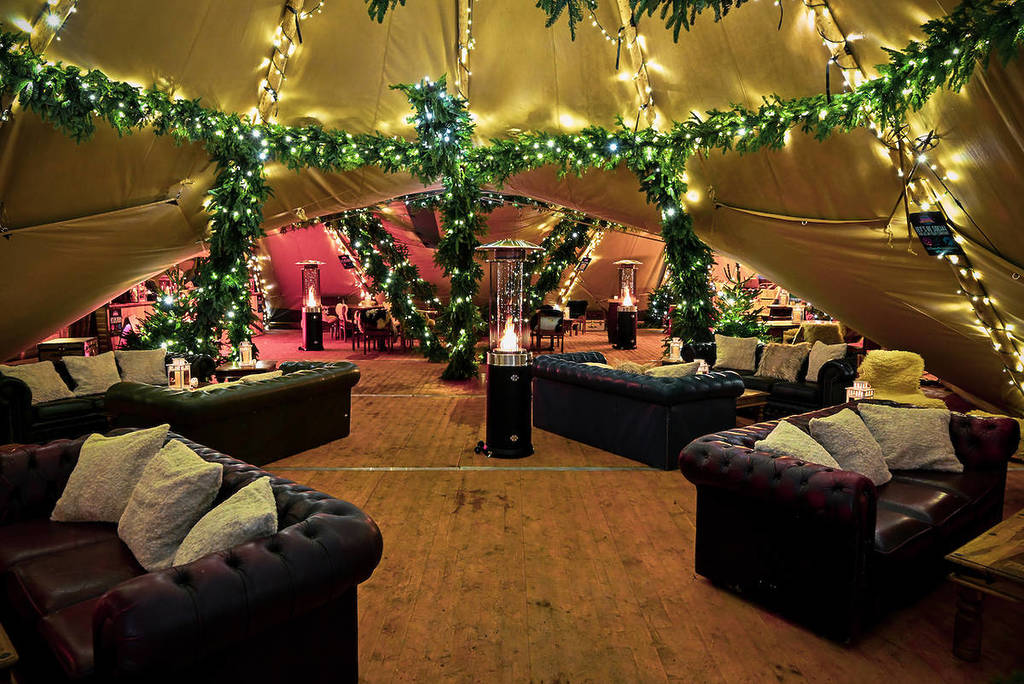 The cosy Apres Ski club with fairy lights and sofas at Tulleys Christmas Lights