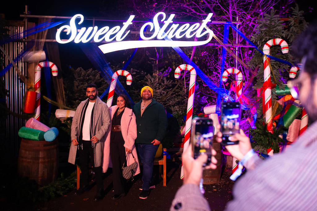 a fun photo op with oversized candy canes at Tulleys Christmas Lights