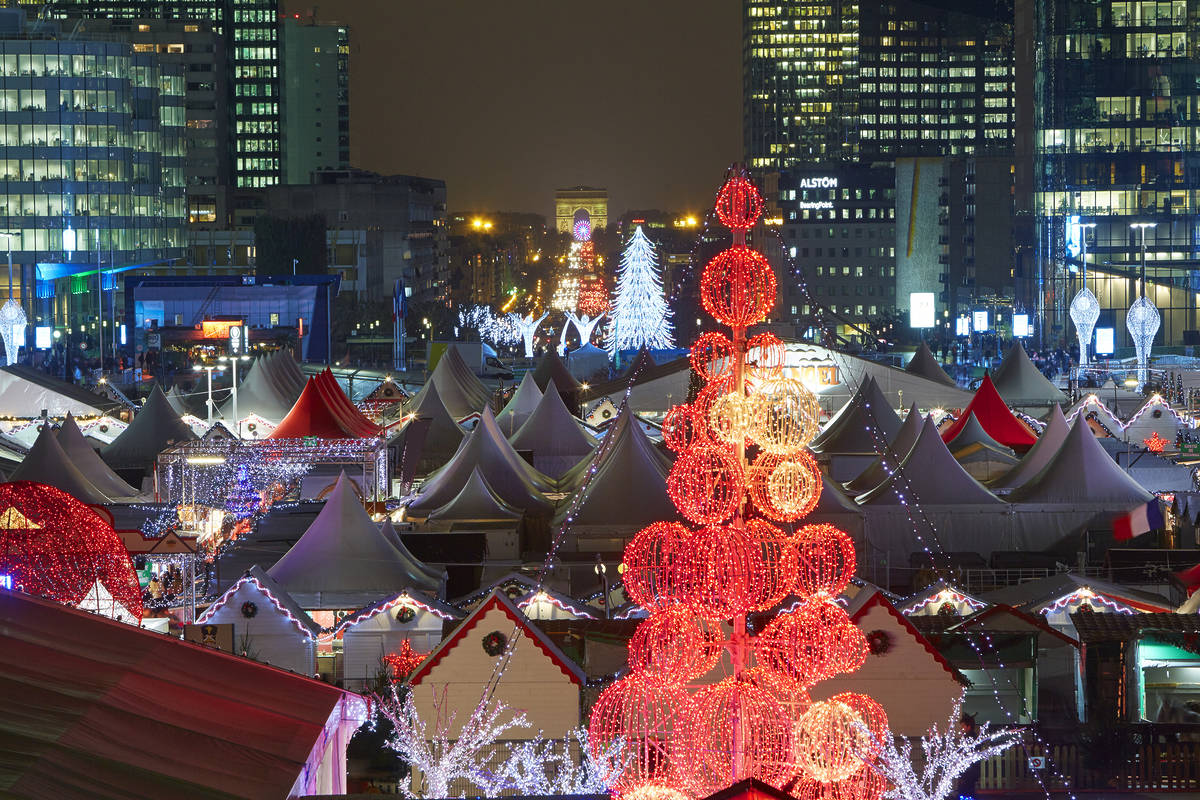 Christmas trees and Christmas Market in Paris L'Defense district illuminated at night