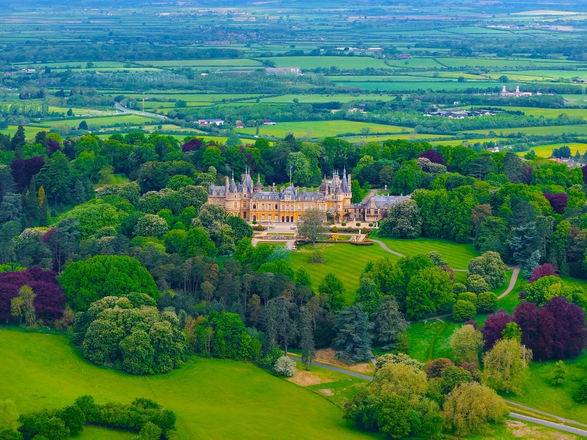 An aerial view of Waddesdon Manor surrounded by gorgeous greenery