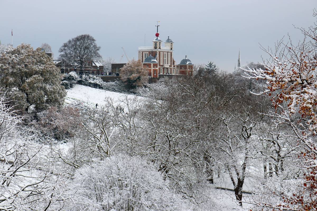 Frost covered trees and a wintery view of the Greenwich Observatory