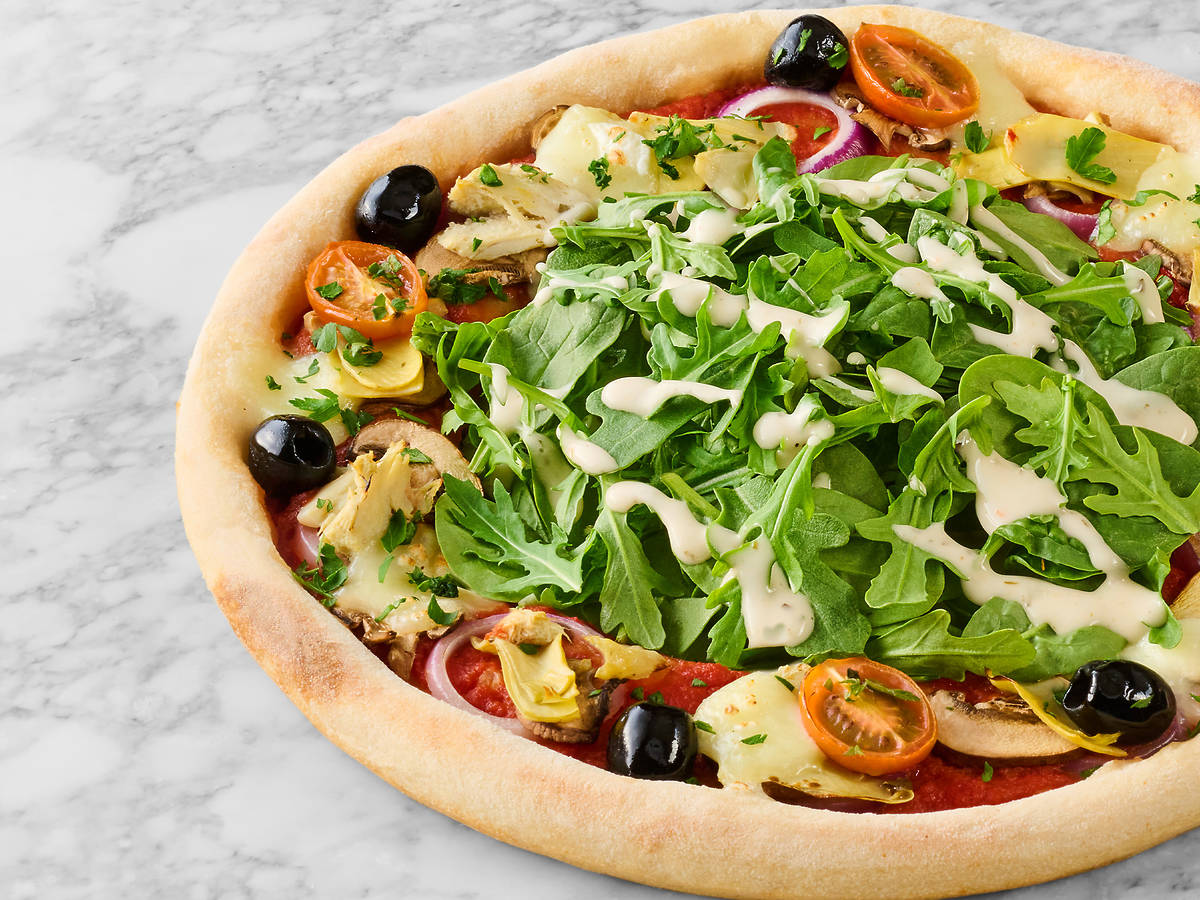 a salad topped pizza