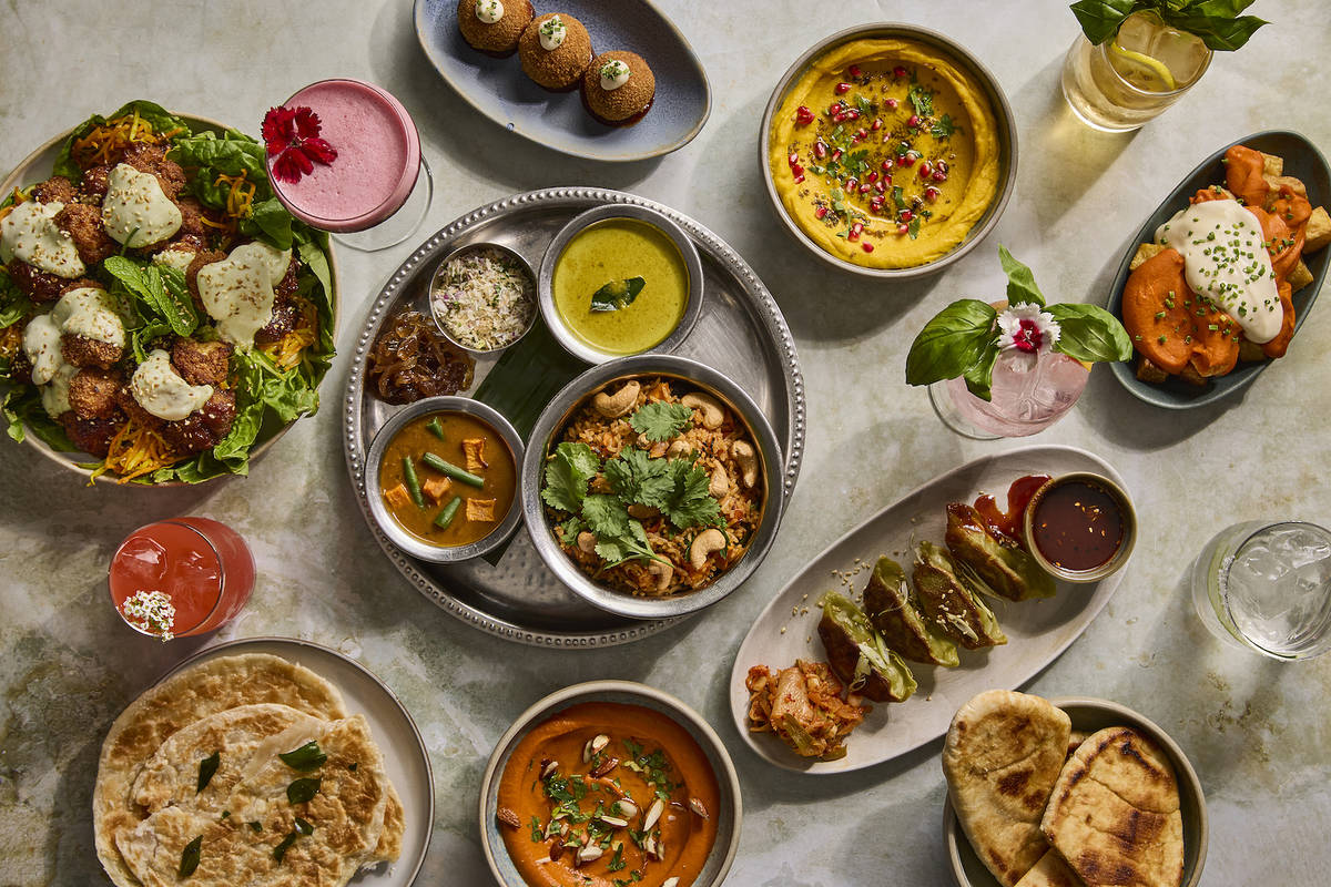 an assortment of colourful vegetarian and vegan dishes presented on a table