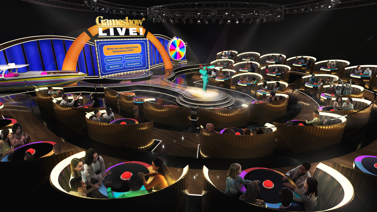 a render showing a large room with a game show hosting area and stage in the middle, ringed by tables featuring big red buzzers and teams of people