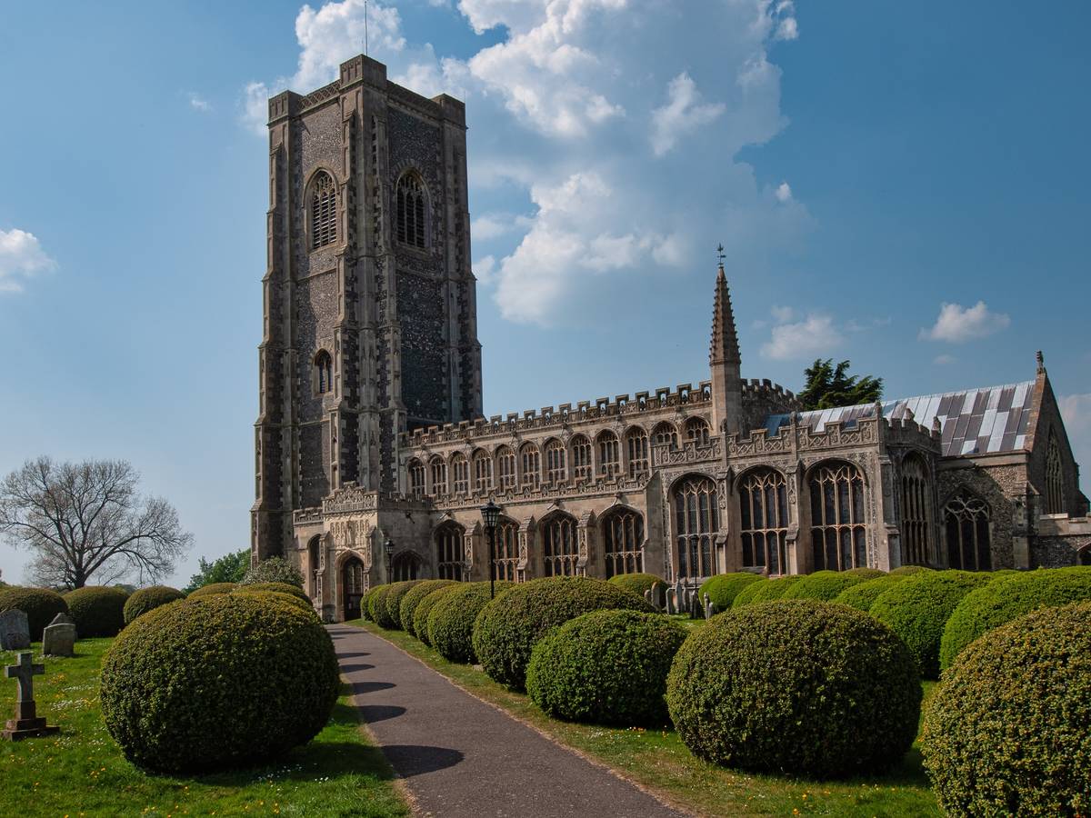 Lavenham Church surrounded by green hedges