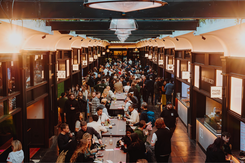 People enjoying food and drink from BOXHALL
