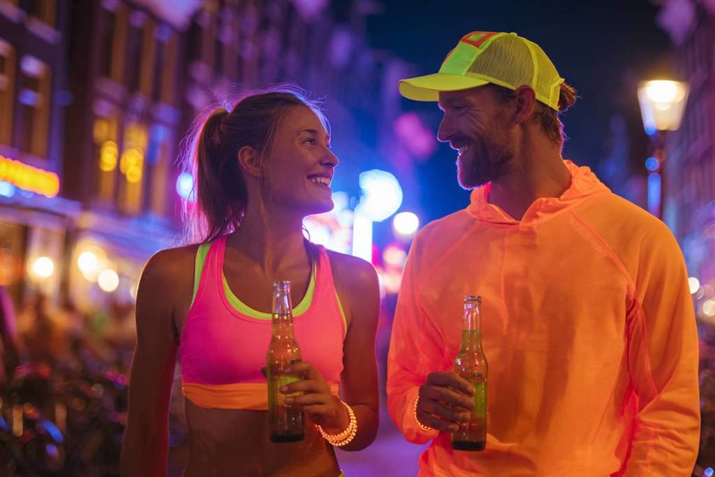 Two runners drinking beer at Luminous Party Run