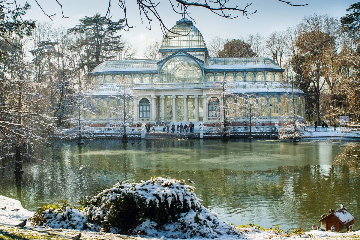 A wintery landscape of Madrid's Crystal Palace in the snow