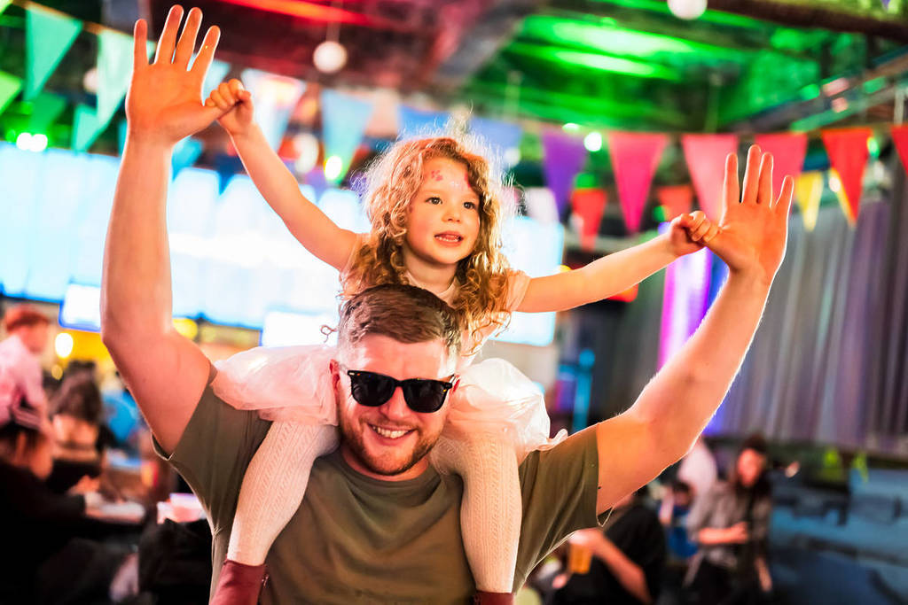 Raver tots festival stage: parent and child