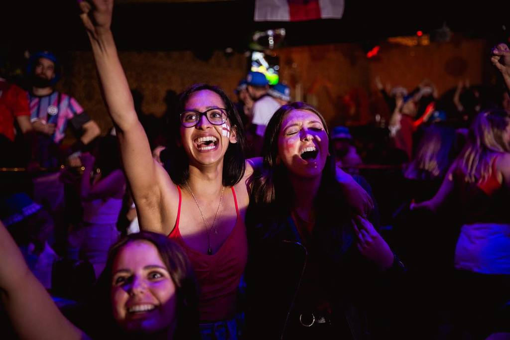 sports fans cheering as they watch a live screening at the clapham grand