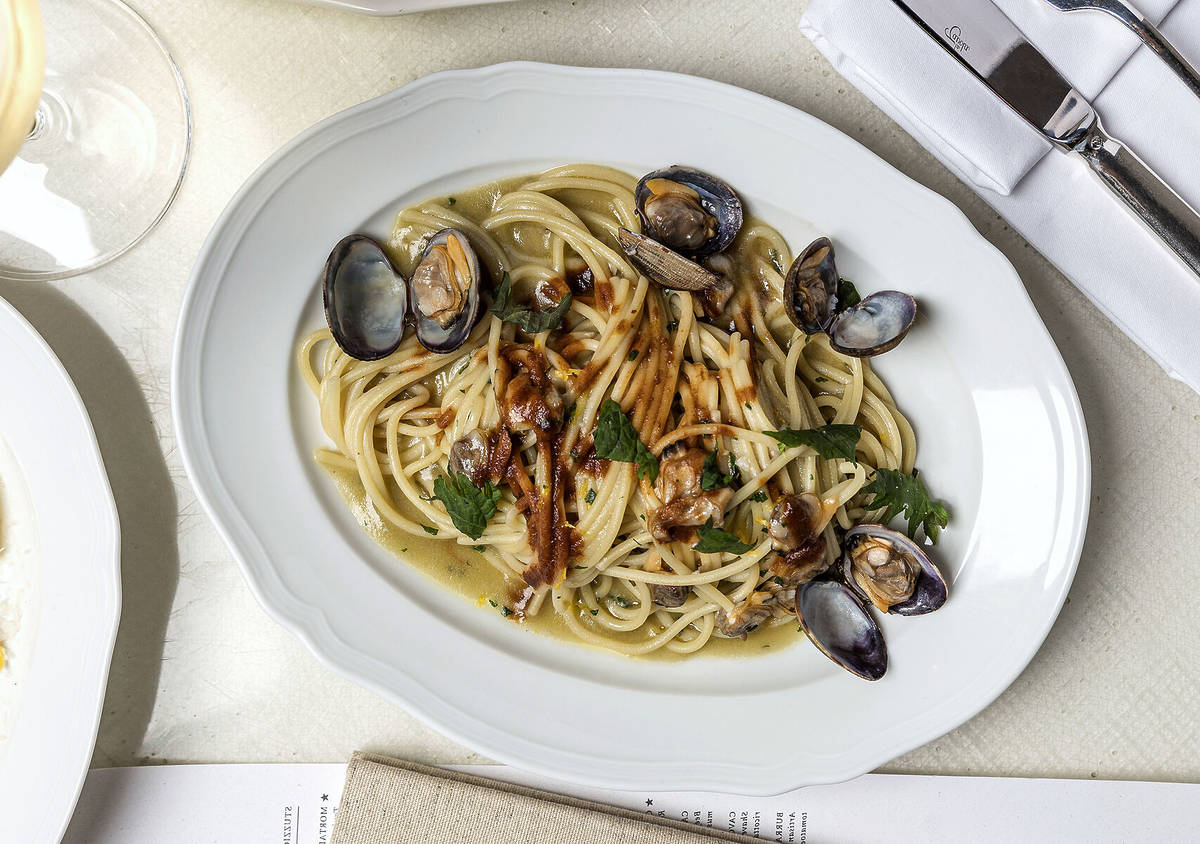 a platter of pasta with shellfish and seafood