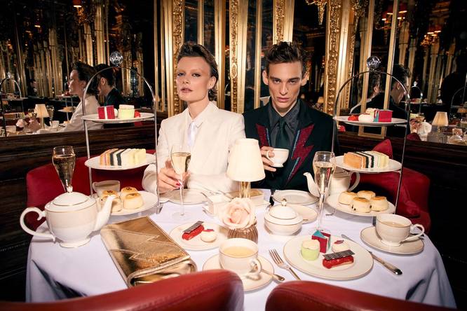 David Bowie Afternoon tea items with two models in Bowie attire sampling the table