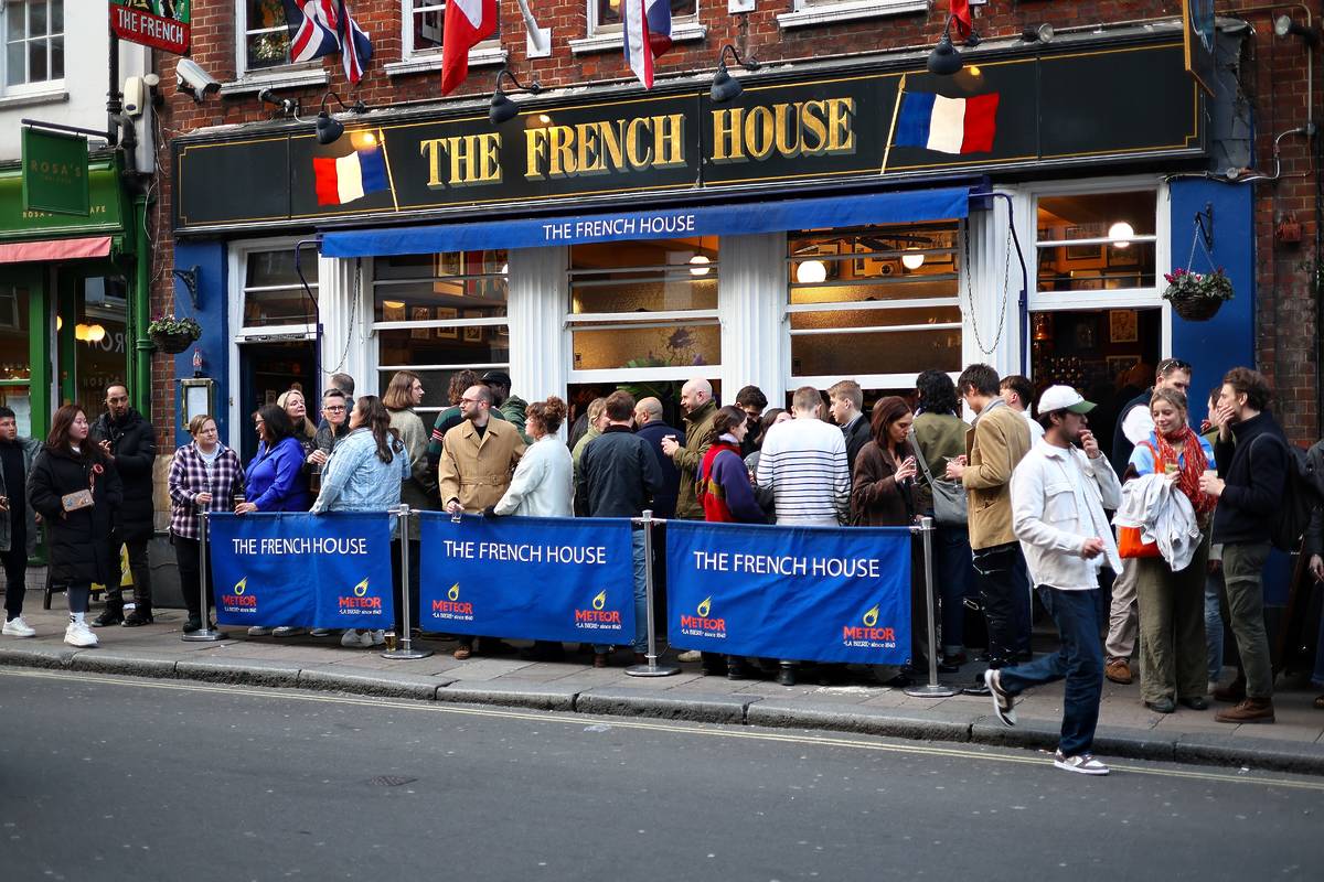 Lots of customers outside the French House pub in Soho