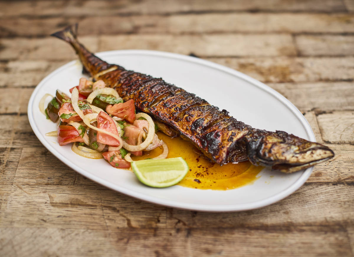 a BBQ'd whole fish with a bright salad/salsa on the side