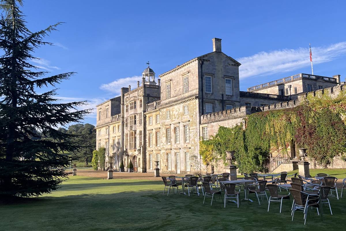 A side view of Wilton House including outdoor seating