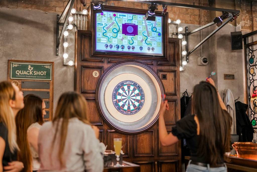friends playing dart
