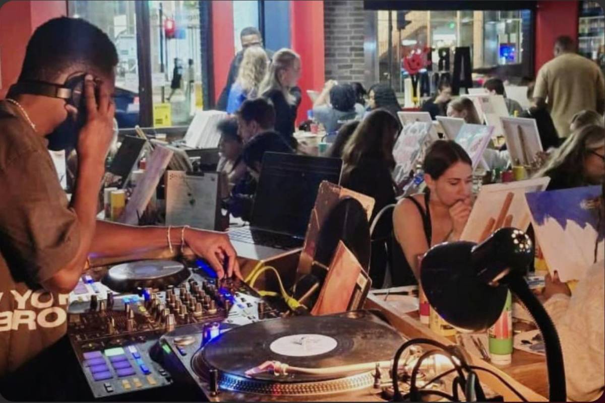 People painting and listening to music at Art Play’s Vibe N Paint Party.