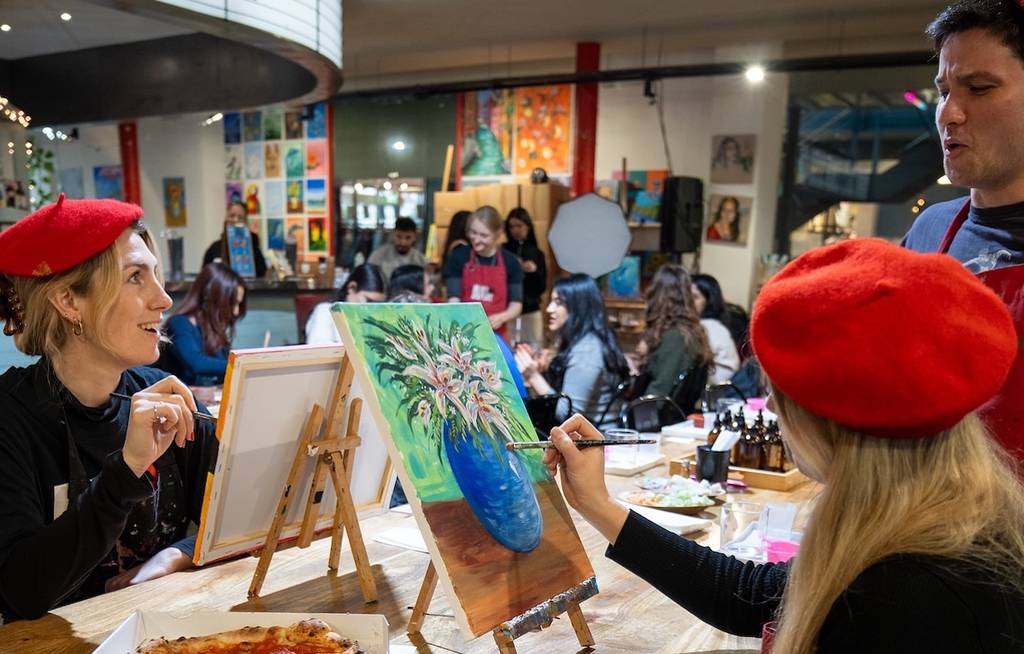 A group painting at an activity in London you can get to with Tel.