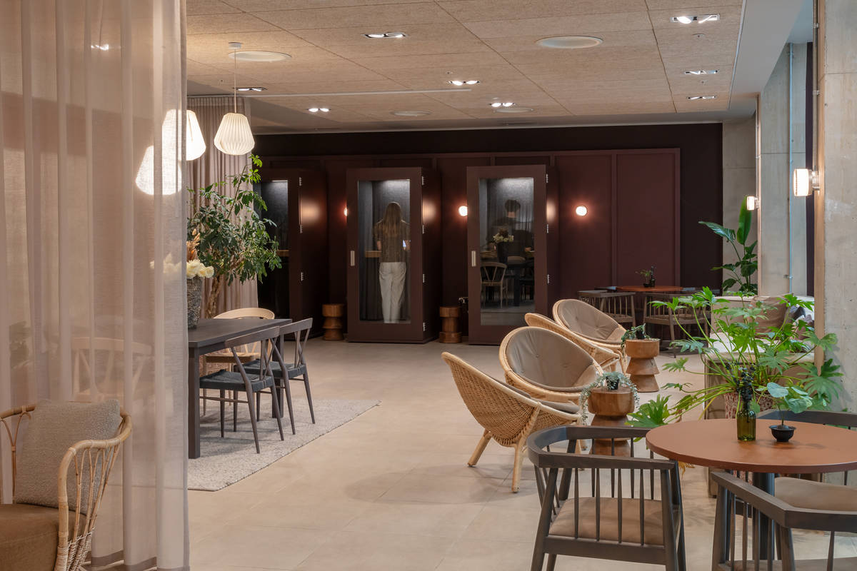 A communal space with meeting pods at Folk Co-Living