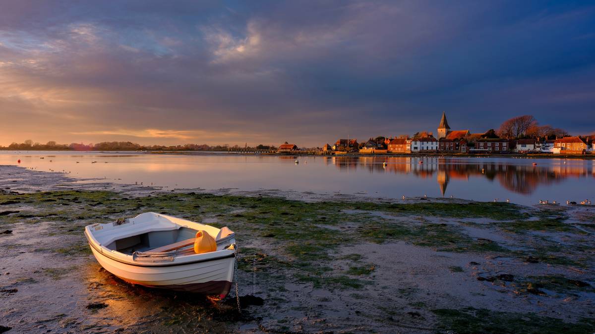 Bosham, UK - December 17, 2022: Mid-winter sunset on Bosham Harbour, West Sussex, UK