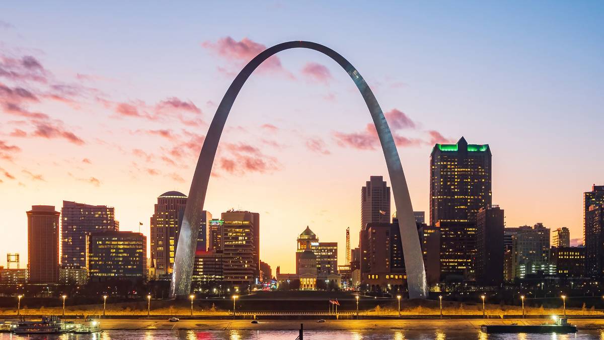 Evening view of the St Louis Skyline with The Gateway Arch in front