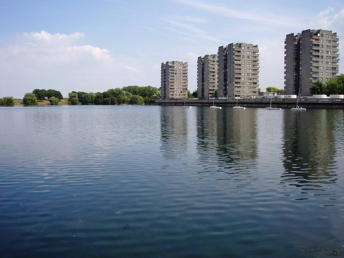 High rise building seen from across an expansive lake