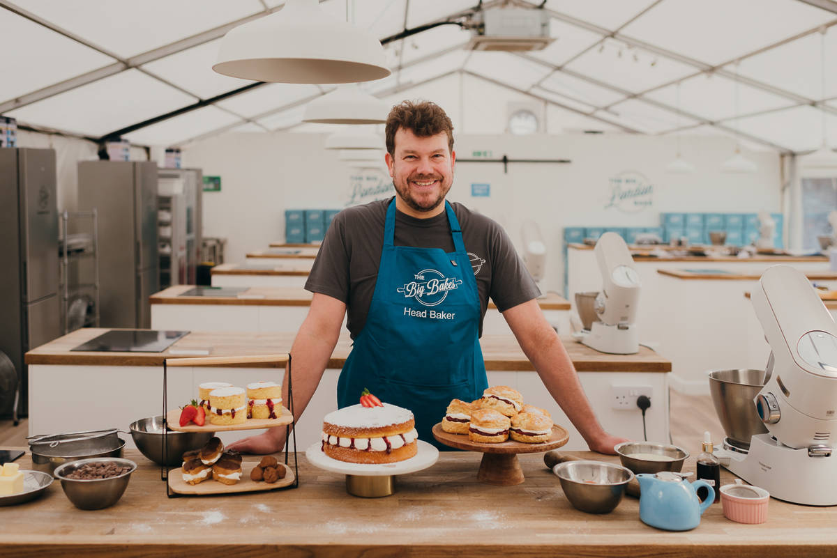 Baker with their creations at The Big Bakes London tent.