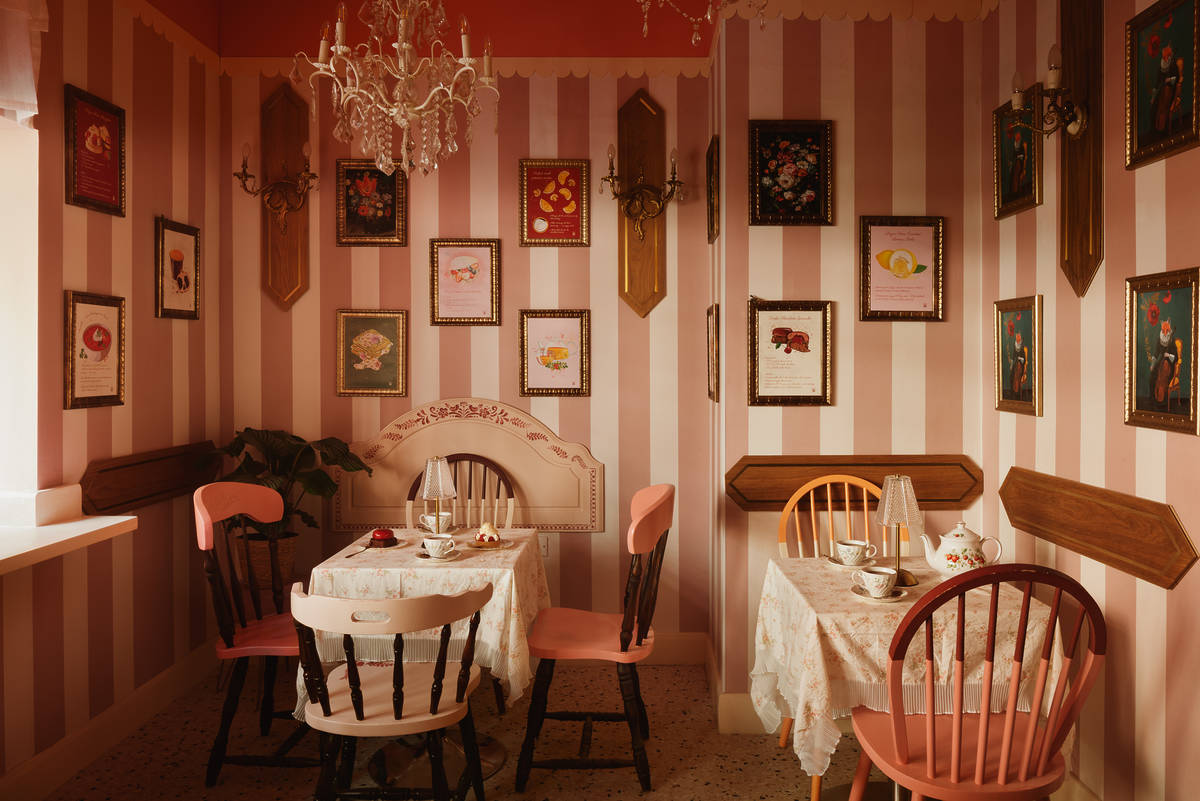 Interiors at Cream Dream with desserts and drinks on the tables.