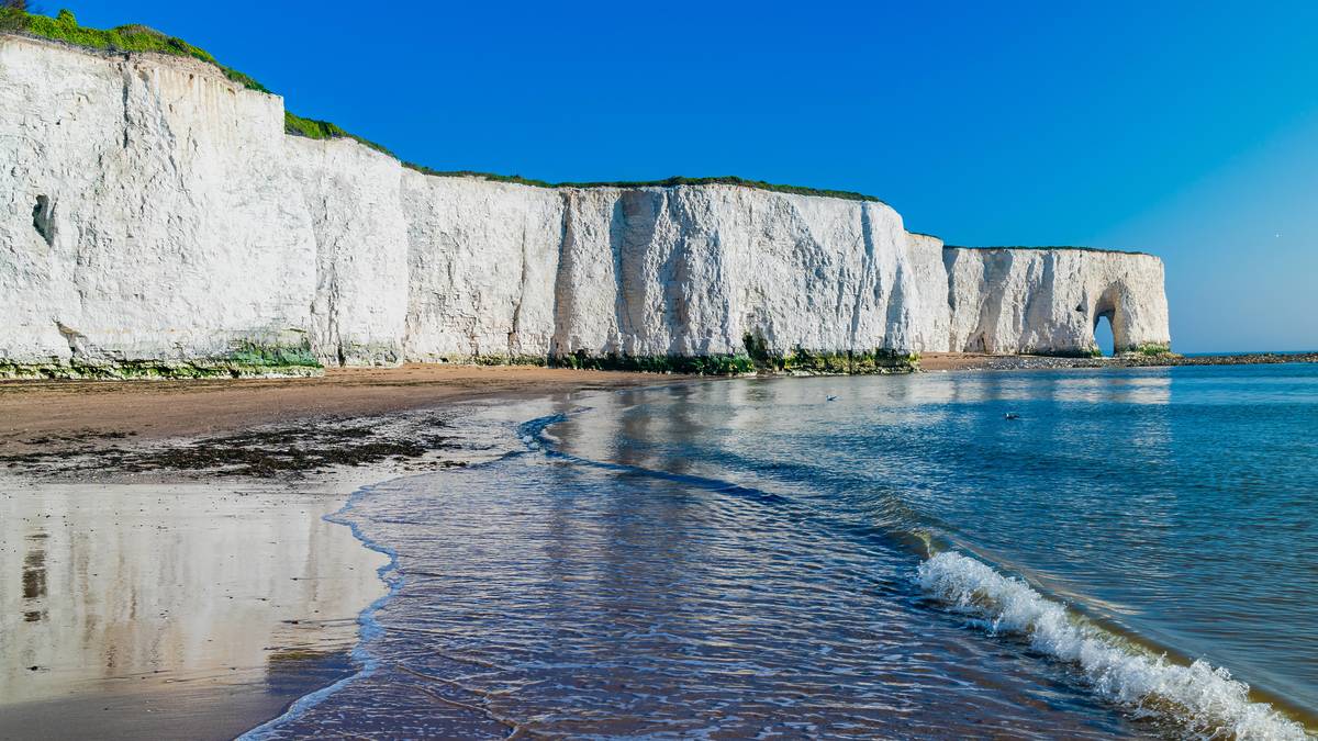 View of white chalk cliffs and beach in Kingsgate Bay, Margate, East Kent, UK