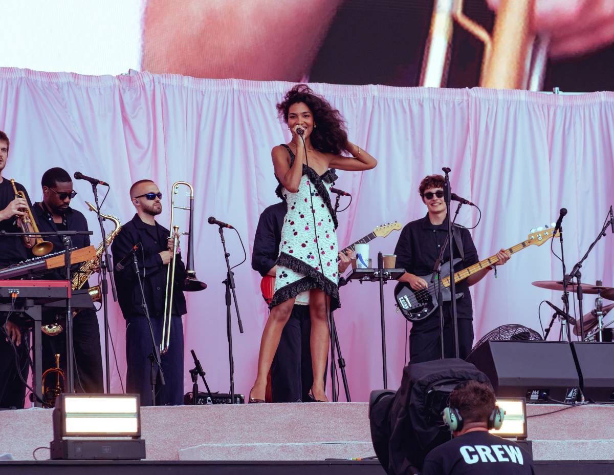 Olivia Dean performing on stage