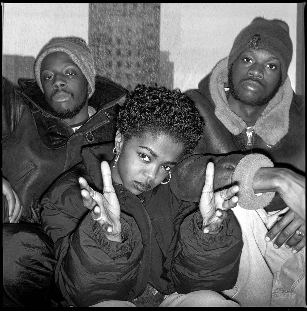 members of the fugees posing for a photo