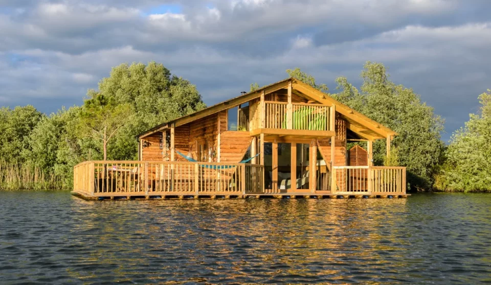 You can sleep in a floating cabin on a private lake near London – with a two-storey sun deck, a hot tub, and your own personal rowboat