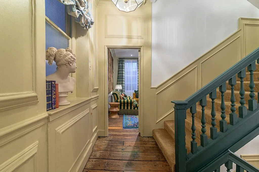 A hallway with a staircase