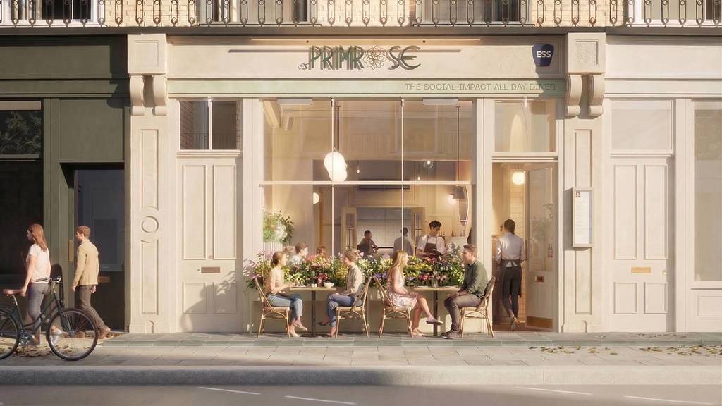 Eine Darstellung der Außenseite des 130 Primrose Restaurants, die ein helles, luftiges Restaurant zeigt, in dem Leute an Tischen vor der Tür saßen