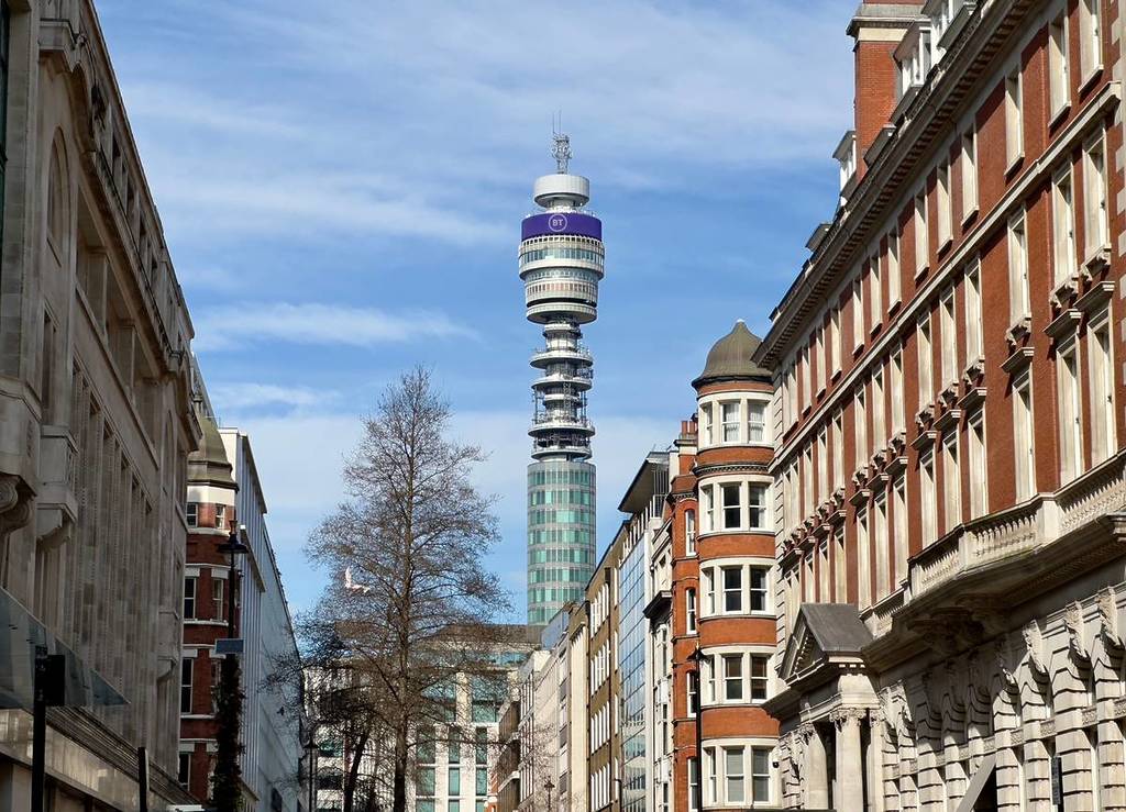 A street in London with a view of the BT Tower at the end of it