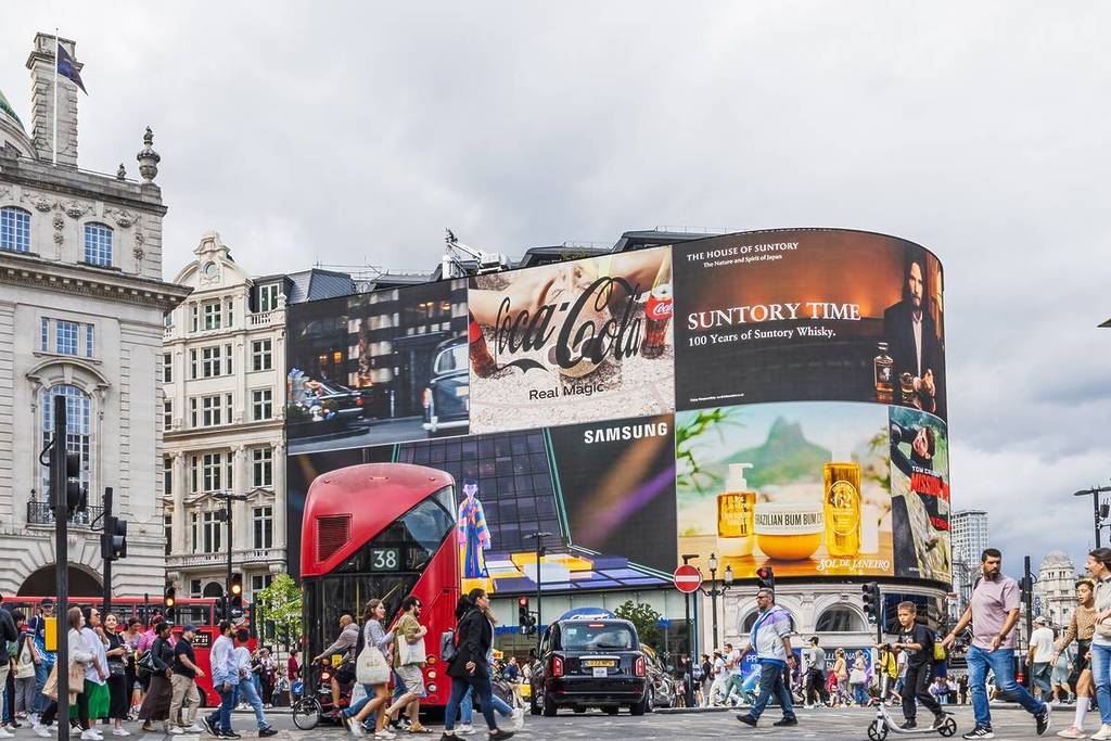 Piccadilly Circus with Advertising Screens and Crowds
