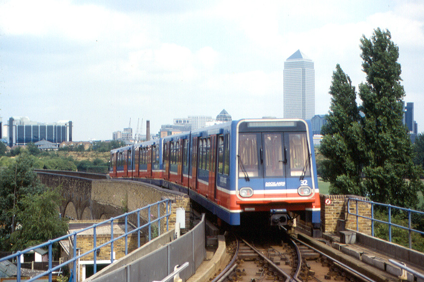an old DLR, in a photo from 1994, looking rather more retro as it travels along the line