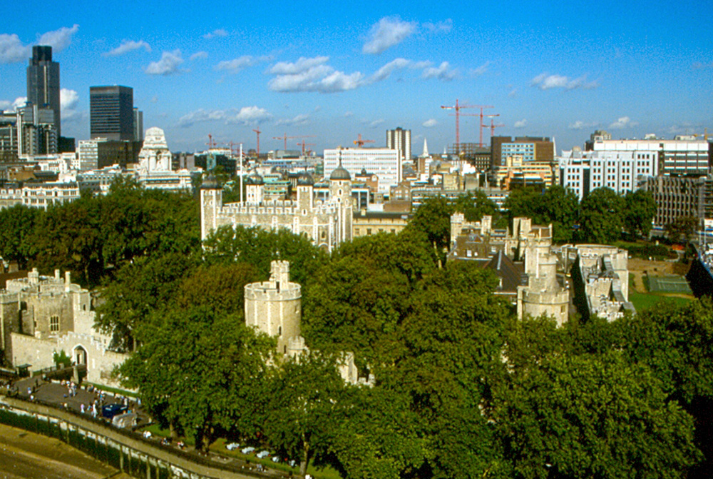 an old photo of a view of london's skyline, largely devoid of skyscrapers, with a focus on the tower of london
