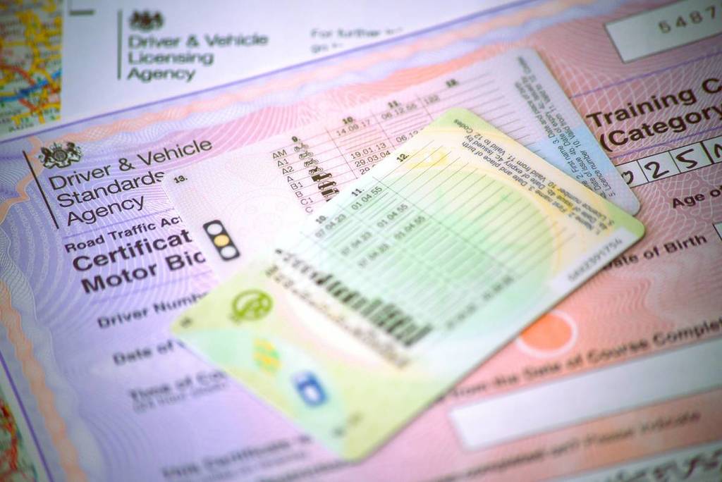 Warrington cheshire UK - may 29 2023: DVLA letter, Dvsa motorcycle CBT certificate with provisional and full British licence.