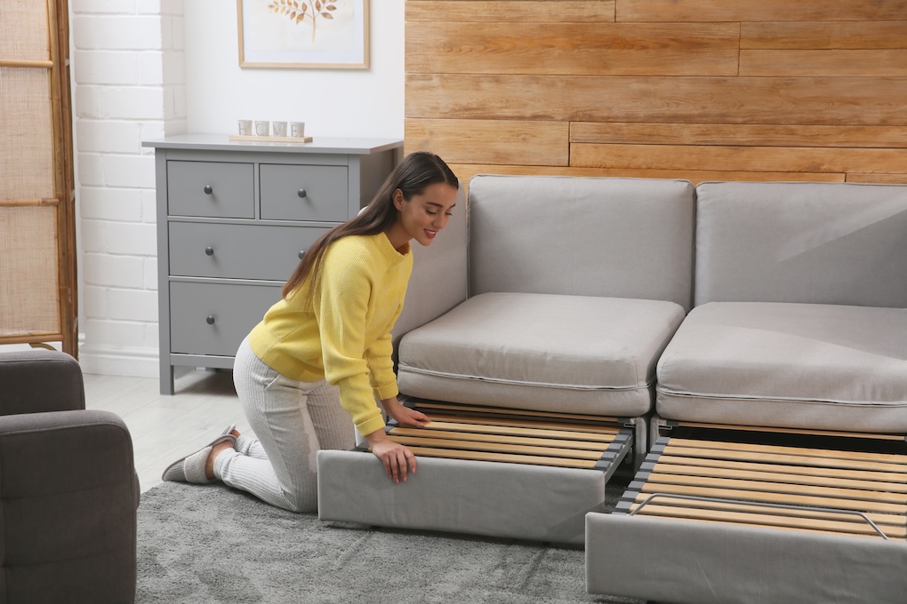 woman with sofa bed small flat